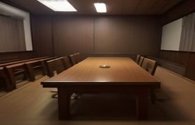内容分级制度研讨会现场，专家围坐讨论影视内容审核标准，会议室灯光明亮专业氛围